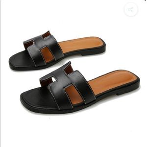 Black cut out sandals.